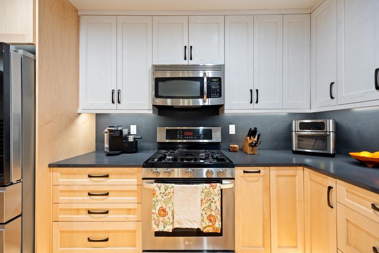 Remodeled luxury home exterior in Olympia with modern upgrades and custom architectural details kitchen