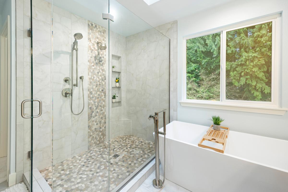 Spa-inspired luxury bathroom remodel in Olympia with walk-in shower and soaking tub